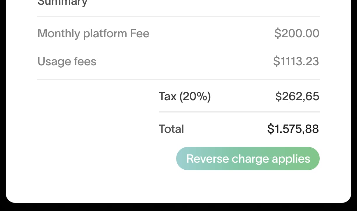 Invoice summary with tax calculation showing a 20% tax line and a reverse charge applies badge